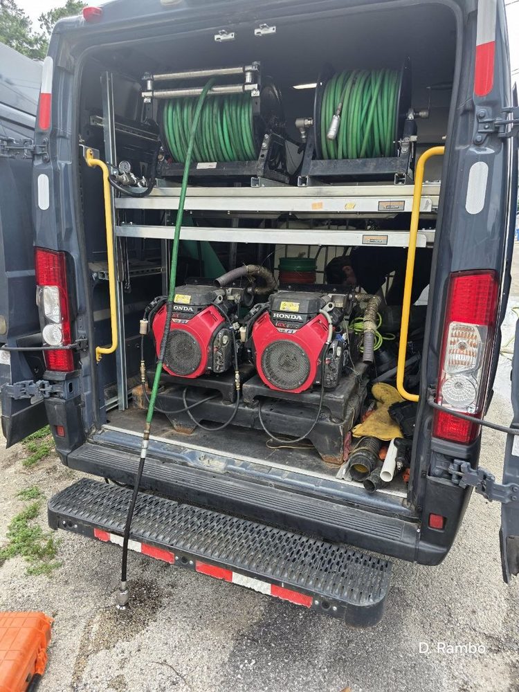 Hydro jetter rig with dual Honda engines and hose reels in the service van