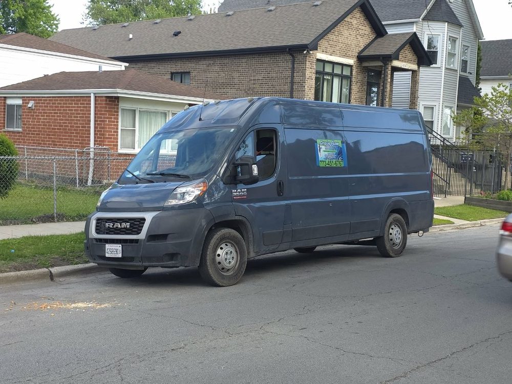 Drain Flow service van parked on a residential street