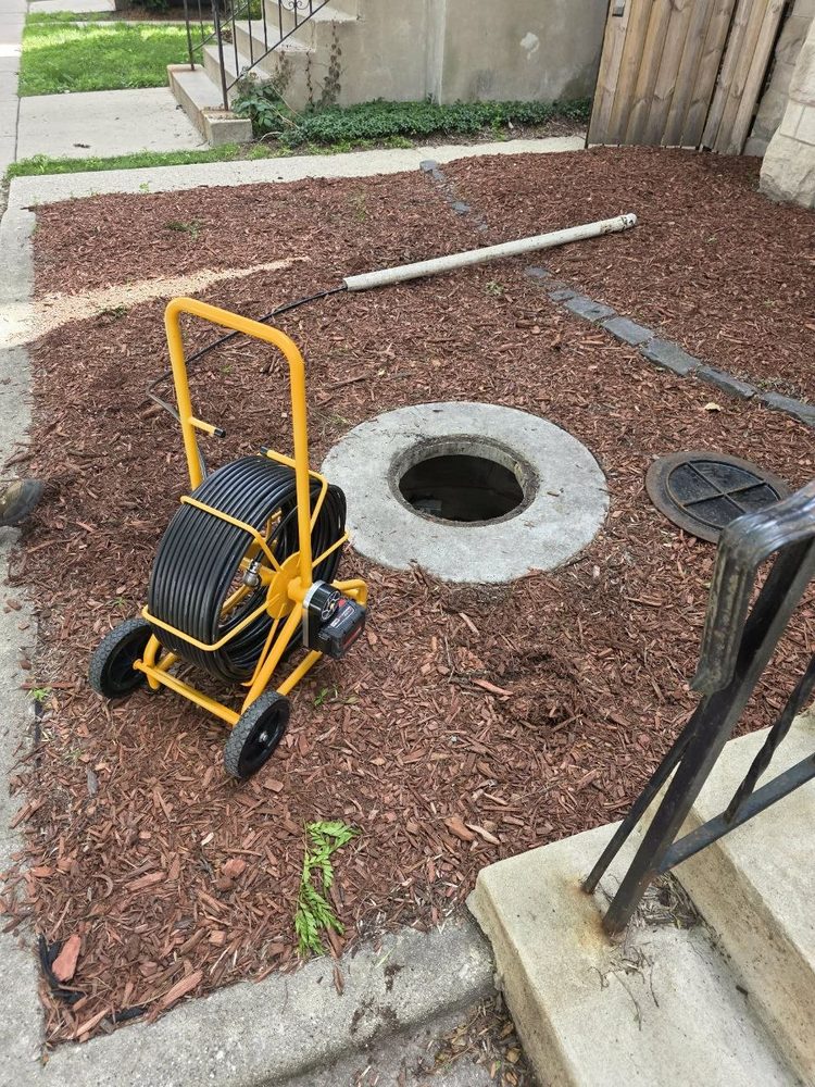 Sewer camera inspection at a manhole